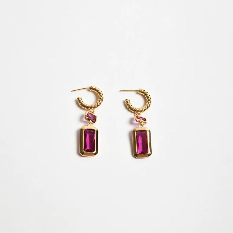 These stunning earrings have a twisted gold hoop and a rectangle shaped jewel drop in hot pink.