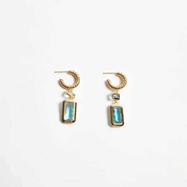 These earrings have a twisted gold hoop with a rectangle teal jewel drop.