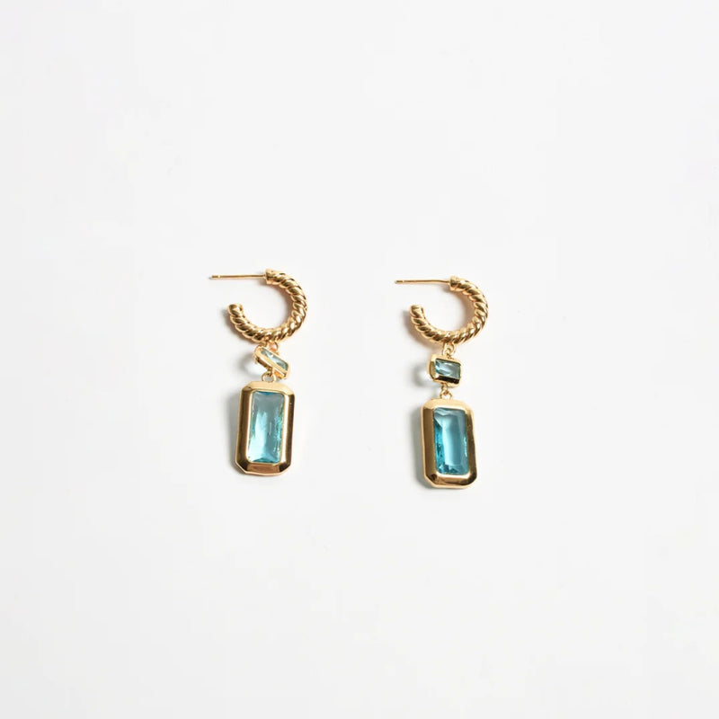 These earrings have a twisted gold hoop with a rectangle teal jewel drop.
