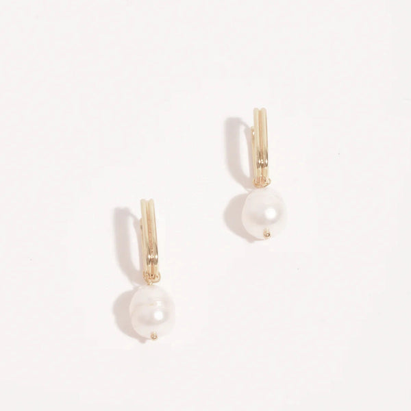 These earrings have a gold ribbed rectangle link with a freshwater pearl suspended.