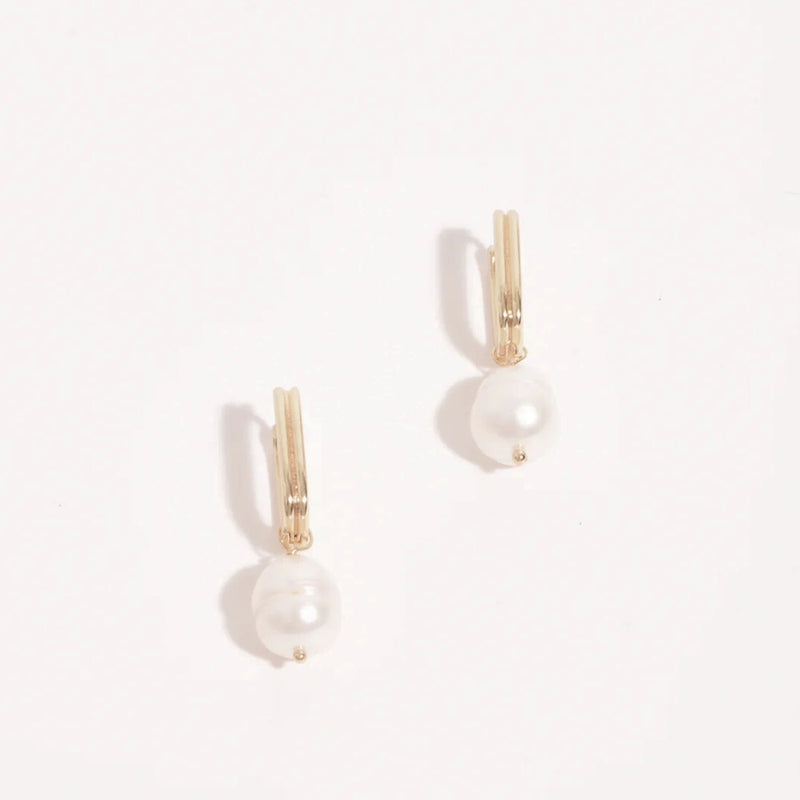 These earrings have a gold ribbed rectangle link with a freshwater pearl suspended.
