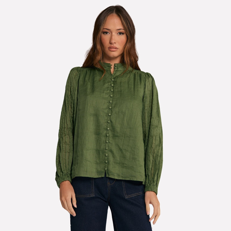 This lovely green shirt has a mock collar, button front and long pleated sleeves.