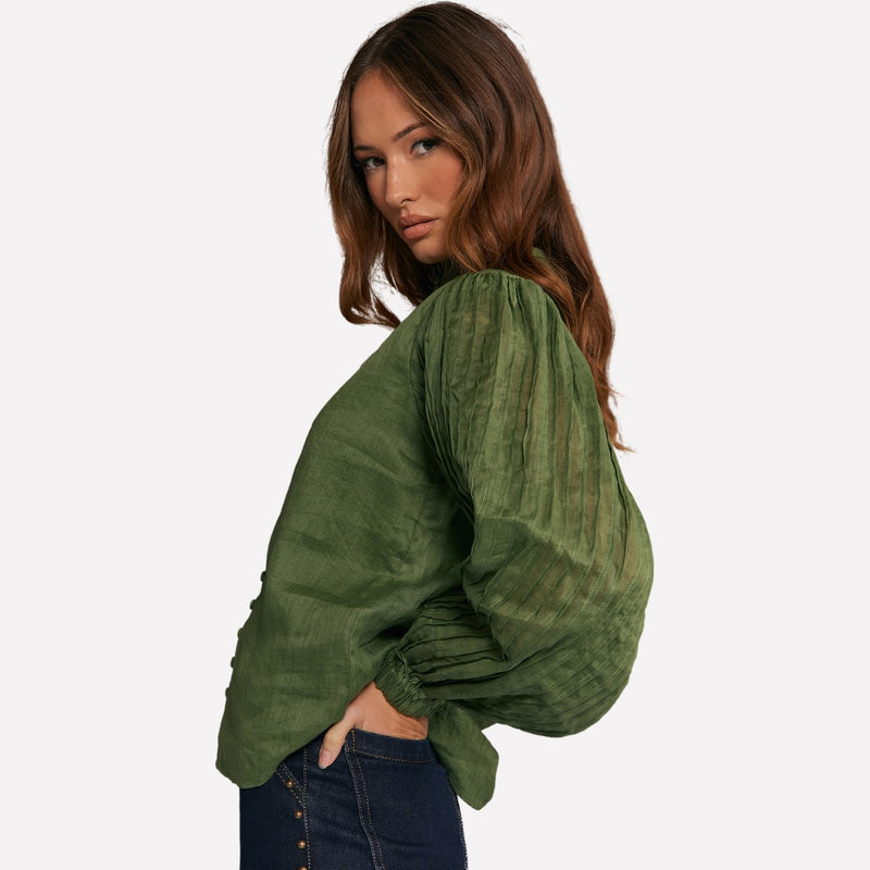 Side view of the shirt and the beautiful pleated sleeves.