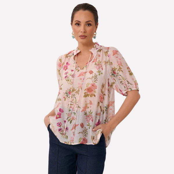 Our Sandra Short Sleeve Floral Top has an exclusive print with a pale pink base and green, pink, peach coloured floral print.
