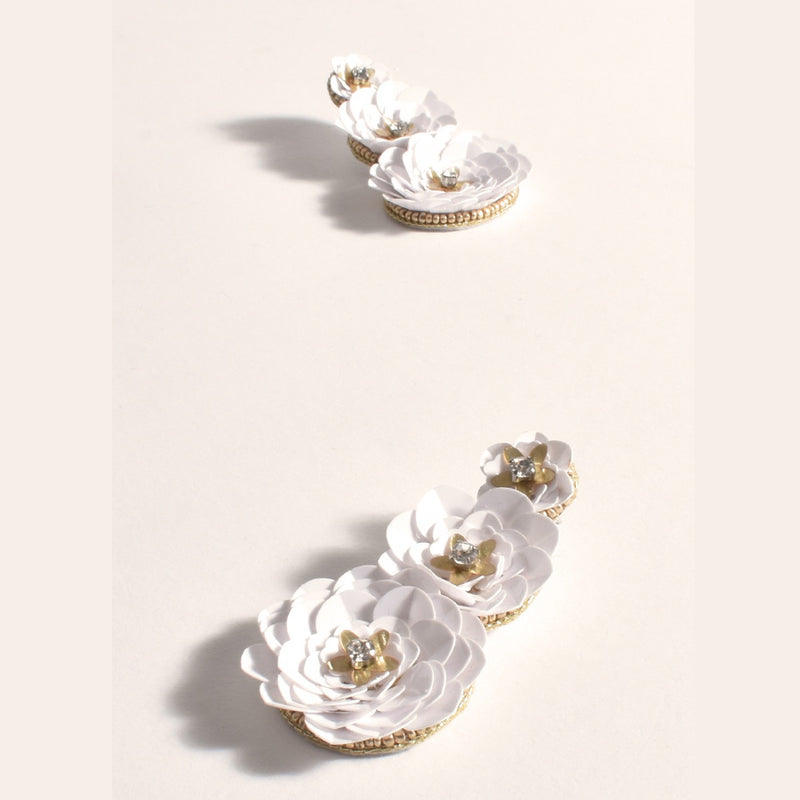 These white earrings have a trio of sequin flowers