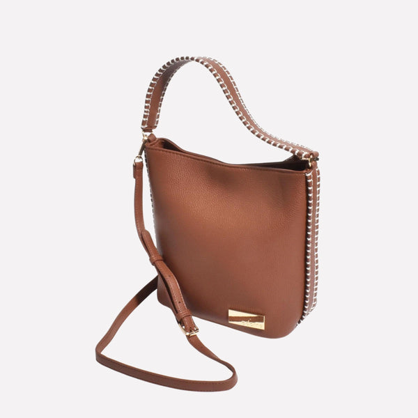 The bag also has a detachable crossbody strap