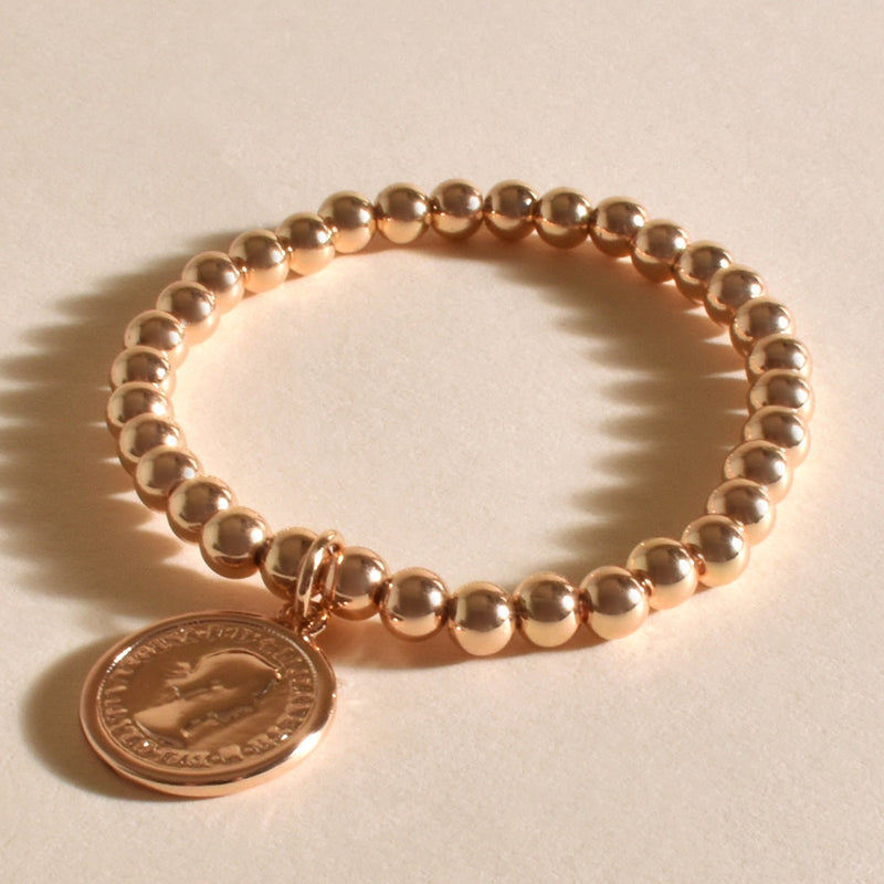 Stretch Ball Bracelet with a gold coin charm