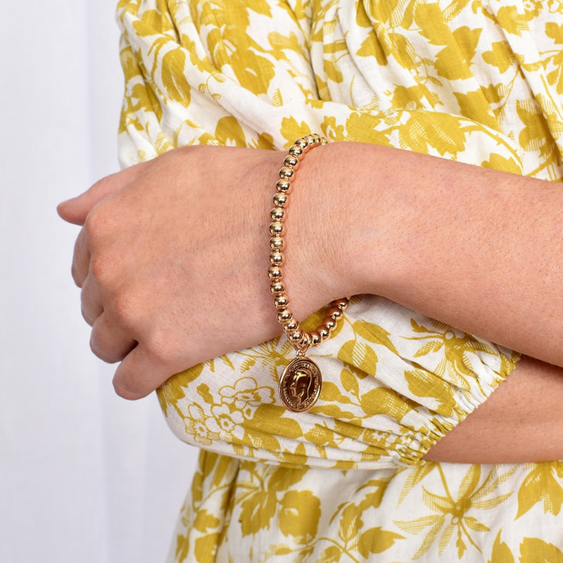 Model image wearing the Stretch Coin Bracelet in Gold