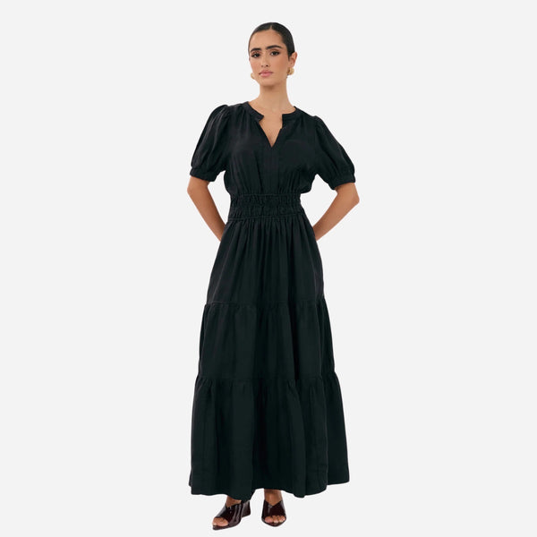 This dress features a round neckline with V cut-out, short sleeves, elasticated waist and a tiered maxi skirt.