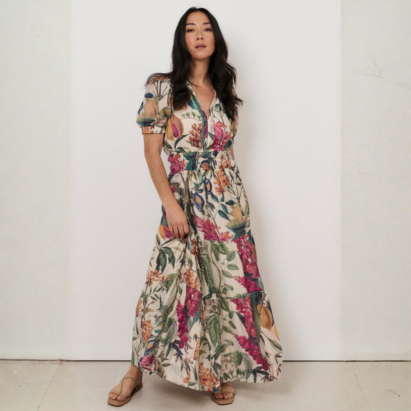 This floral maxi dress has a V neckline, short sleeves and a tiered maxi skirt.