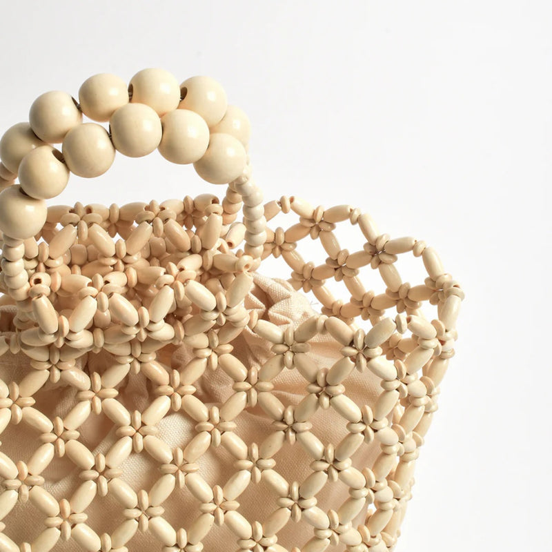 Close up of the beaded detail and the top handle.