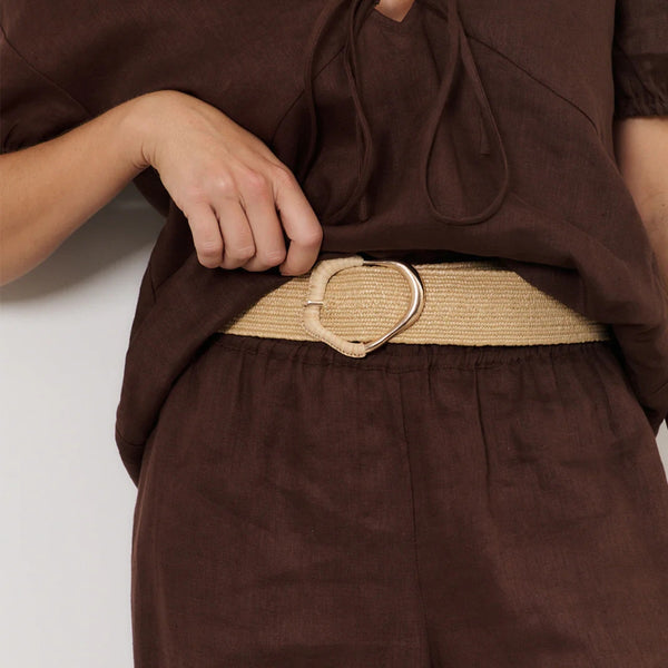 Wrapped Buckle Stretch Belt in Camel being showcased on a model.