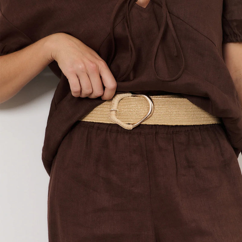 Wrapped Buckle Stretch Belt in Camel being showcased on a model.