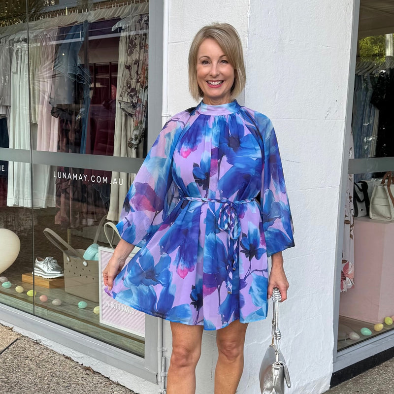 The fabric has a chiffon feel and the dress is lined throughout the body.