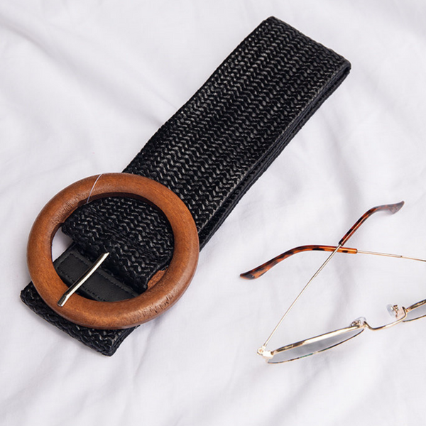 This black stretch belt has a round wooden buckle