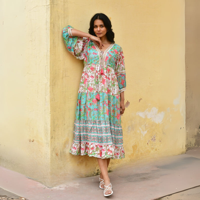 the dress can be styled with sandals throughout the day.