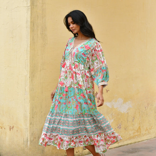 This maxi dress has a V neckline, neck ties, 3/4 length sleeves and a loose fit body.