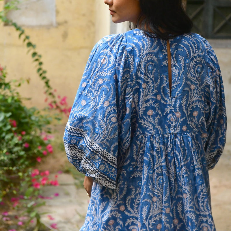 Upper back view of the dress - it has a button closure and keyhole cut-out.