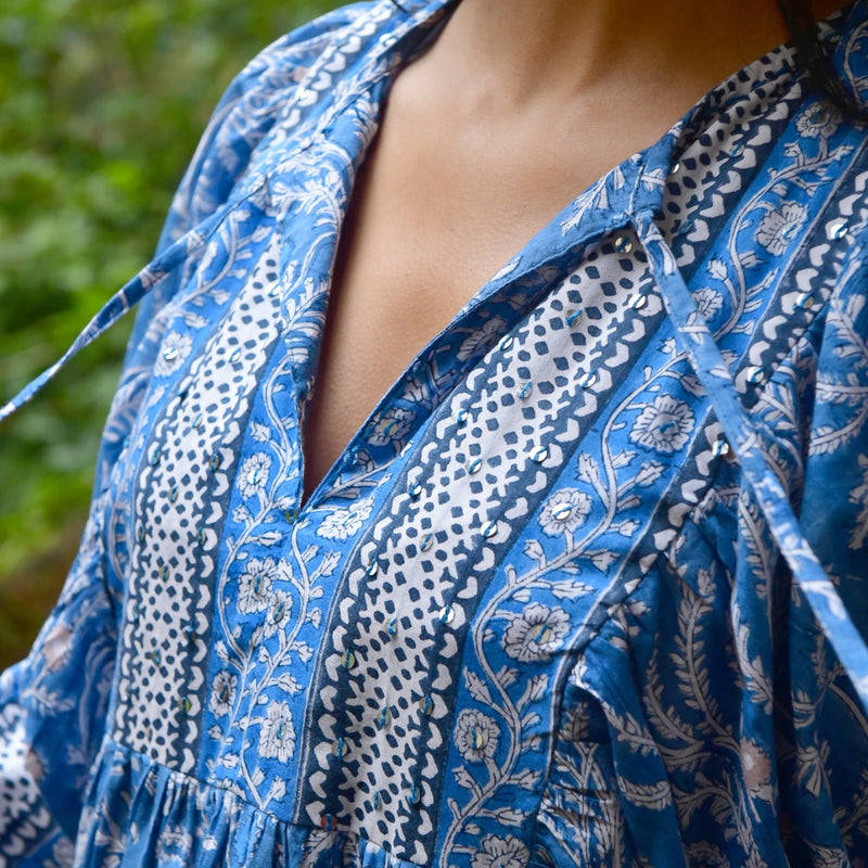 Close up of the bodice area which has subtle sequin detailing. 