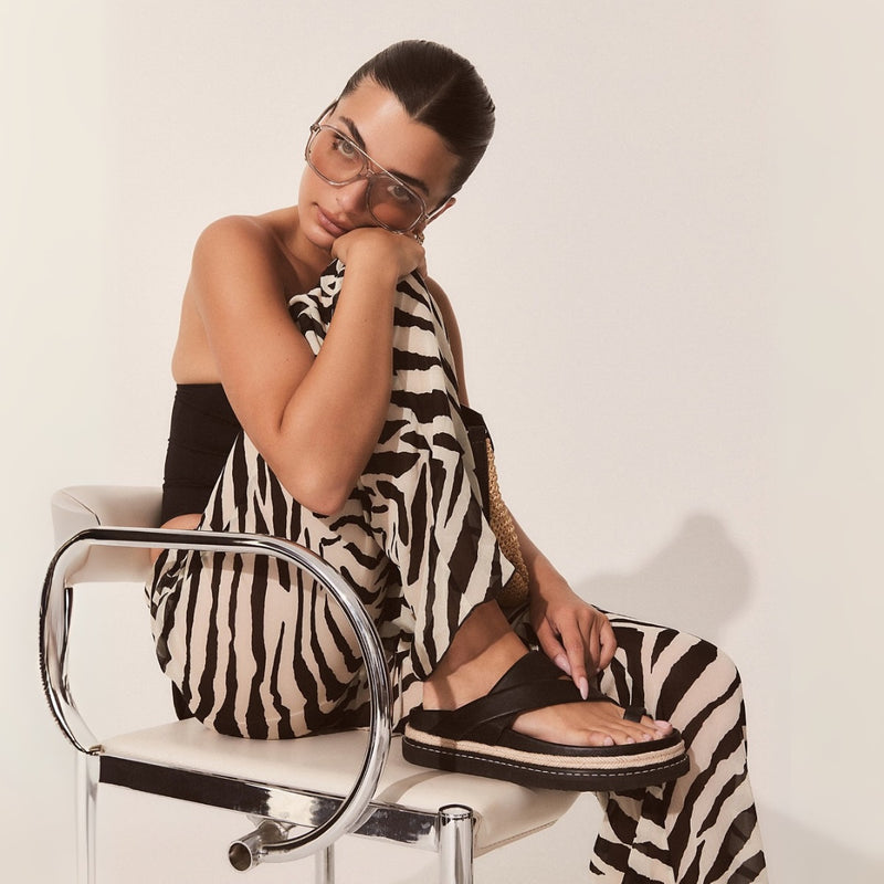 Model wearing the brown slides.