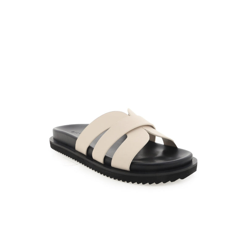 These platform slides have a black rubber sole and bone cut-out straps