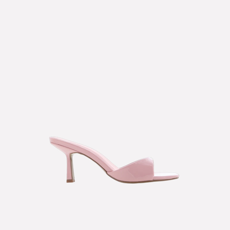 Side view of the shoes - they have a kicked in stiletto heel, mid height.
