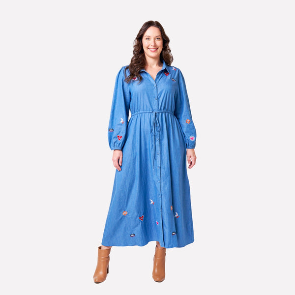 The dress also has embroidered patches on the upper bodice, sleeve edge and hem
