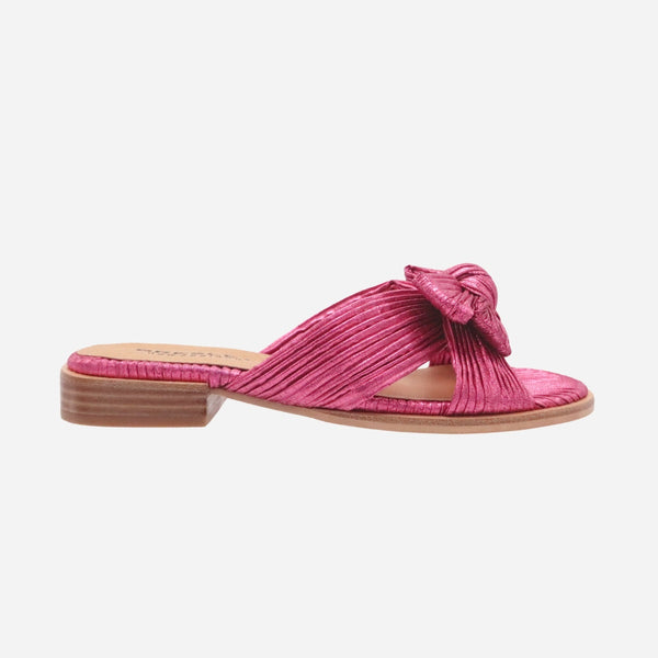 Sam Bow Slides in a hot pink textured fabric with crossover straps and a bow detail.