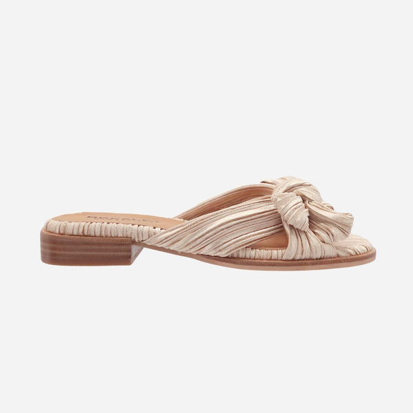 Sam Bow Slides in a sand coloured textured fabric with crossover straps and a bow detail.