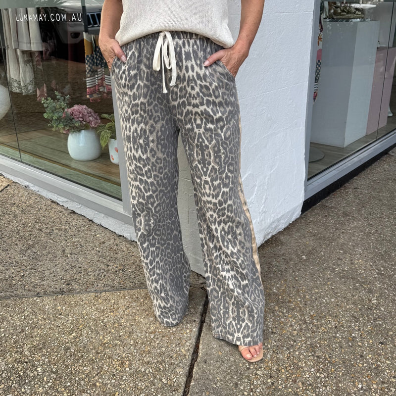 Leopard Racer Pants in beige and grey. These straight leg pants have a drawstring waist and front pockets.