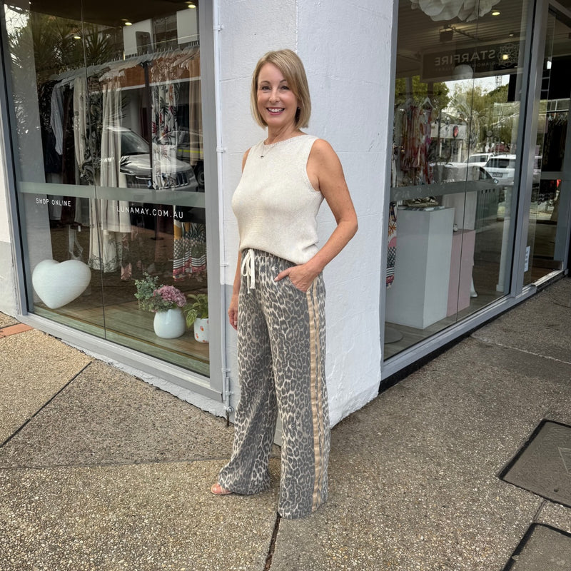 Full length side view of the pants and top.