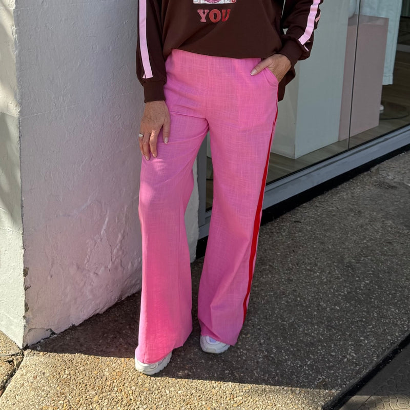 The pants have front pockets and an elastic waist.