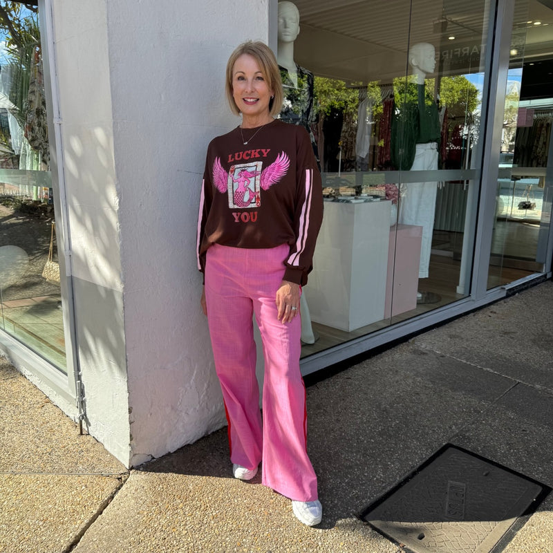 The pink pants have a straight leg 