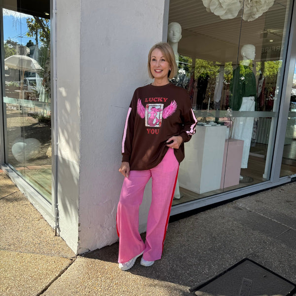 The Lucky You Pant Set is ultra fun! Includes a brown sweater with a pink mermaid print and Lucky You on the front along with pink stripes on the sleeve.