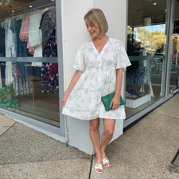 Medusa Button Dress with a V neckline, button front and short flutter sleeves