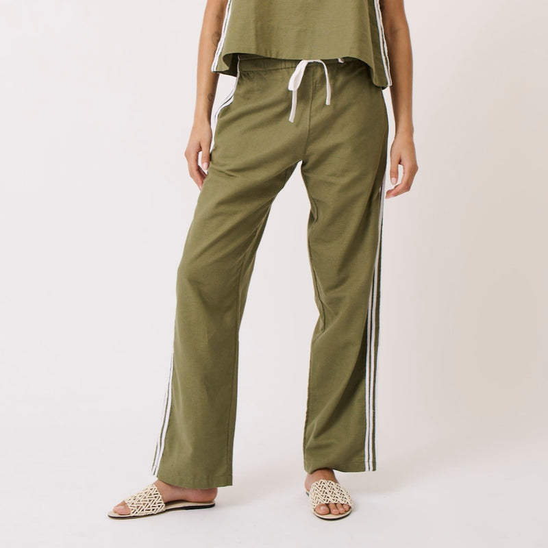 Our Nadine Pants by Cartel & Willow are in a khaki colour and they have white stripes down the side of the pants.