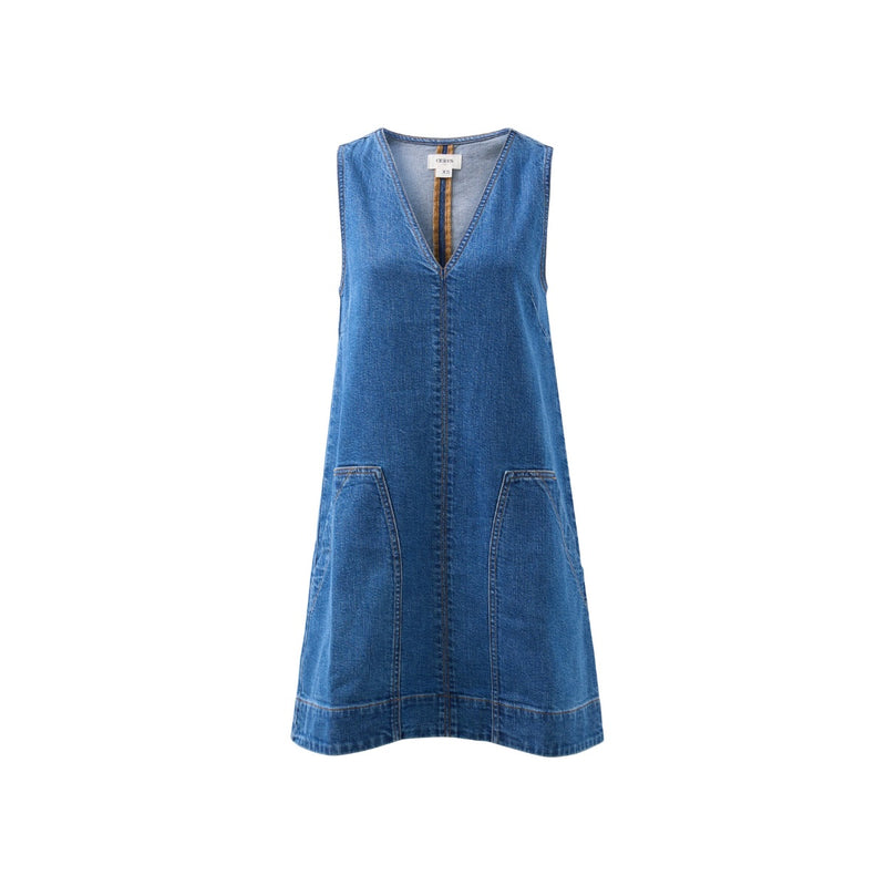 The dress has a V neckline and large patch pockets.