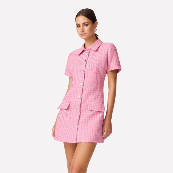 The dress features a collar, silver buttons with diamantes and it has faux hip pockets.
