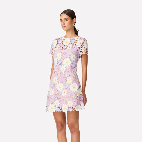 This mini dress features a round neckline, short sleeves and it has a semi-fitted shape.