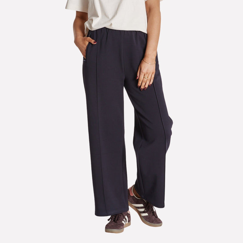 Noah Pants in navy. They have a slight cropped leg.