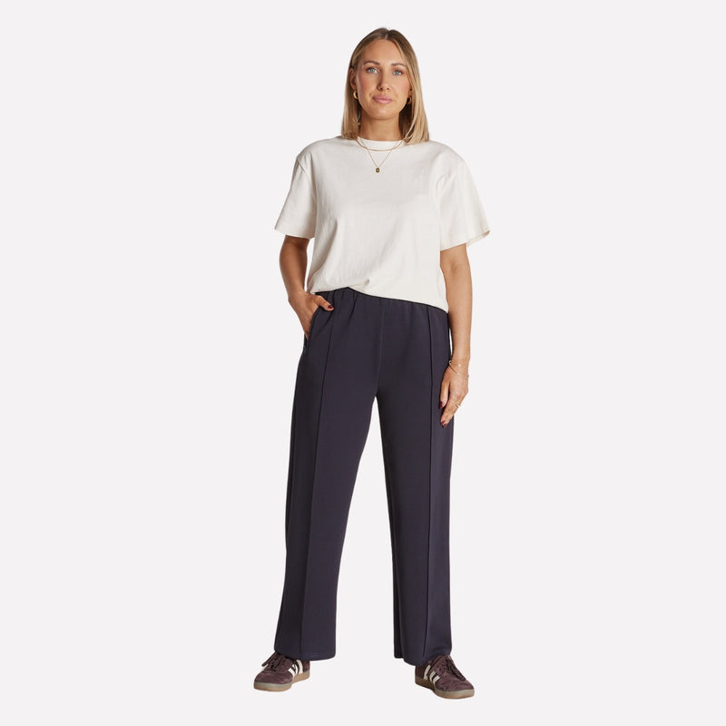 These navy pants also have a centre seam down the front of each leg