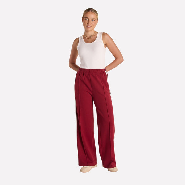 These burgundy coloured pants are longer length and they have a straight leg.