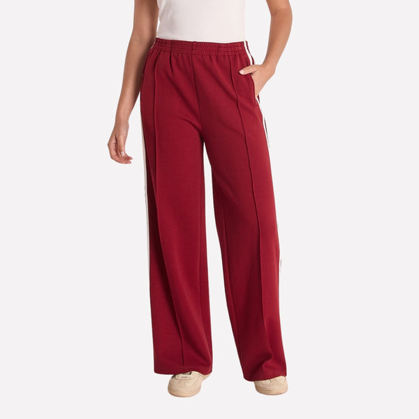 Noah Wide Leg Pants in Burgundy with white side stripes.