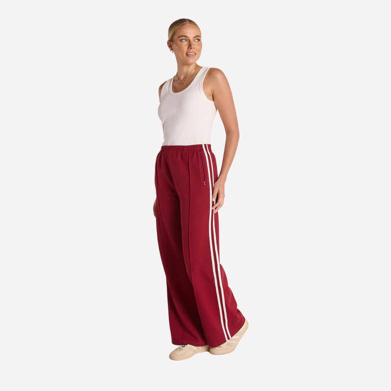 Side view of the pants worn with a white singlet.