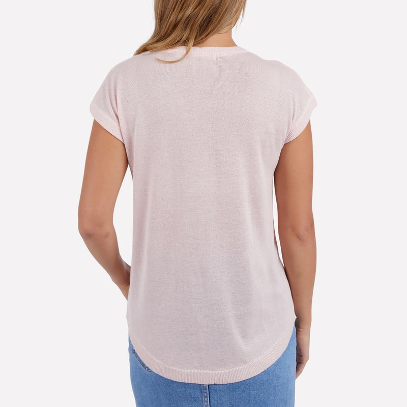 Back view of the top which has a curved hem