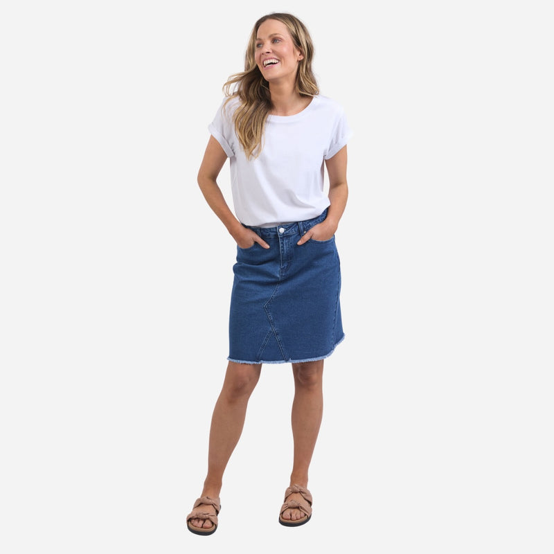 the skirt can be paired with a tee and slides for an easy off-duty look.