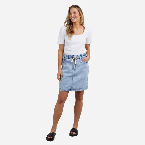 The skirt can be worn with a tee and slides for an off duty look.