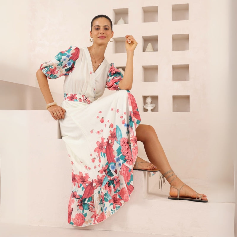 The dress has short sleeves, a faux wrap bodice and a maxi length skirt.