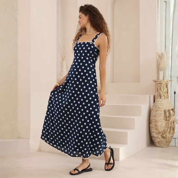 This dress has wide adjustable shoulder straps, a fitted bodice and a maxi length skirt.