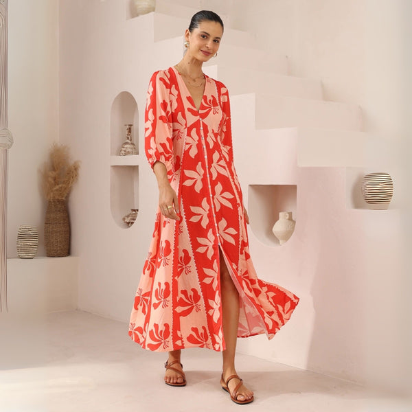 The dress has a button front and an Aline maxi length skirt with front split.